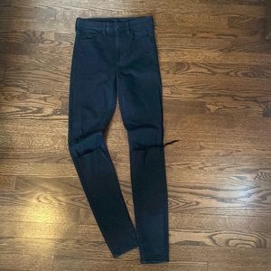 AE Next Level Stretch black distressed skinny jeans